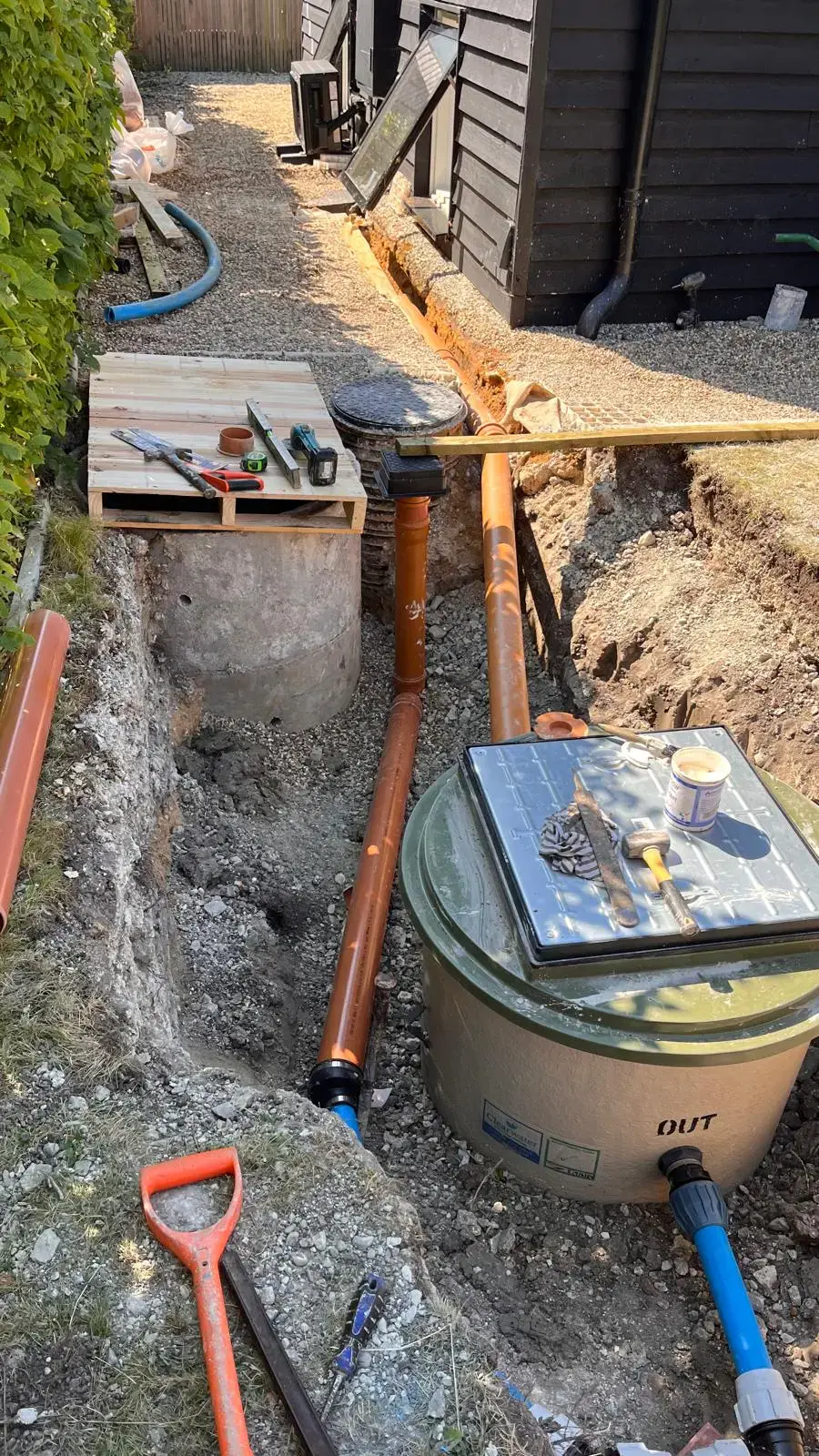 Drainage pipes installed beside a house