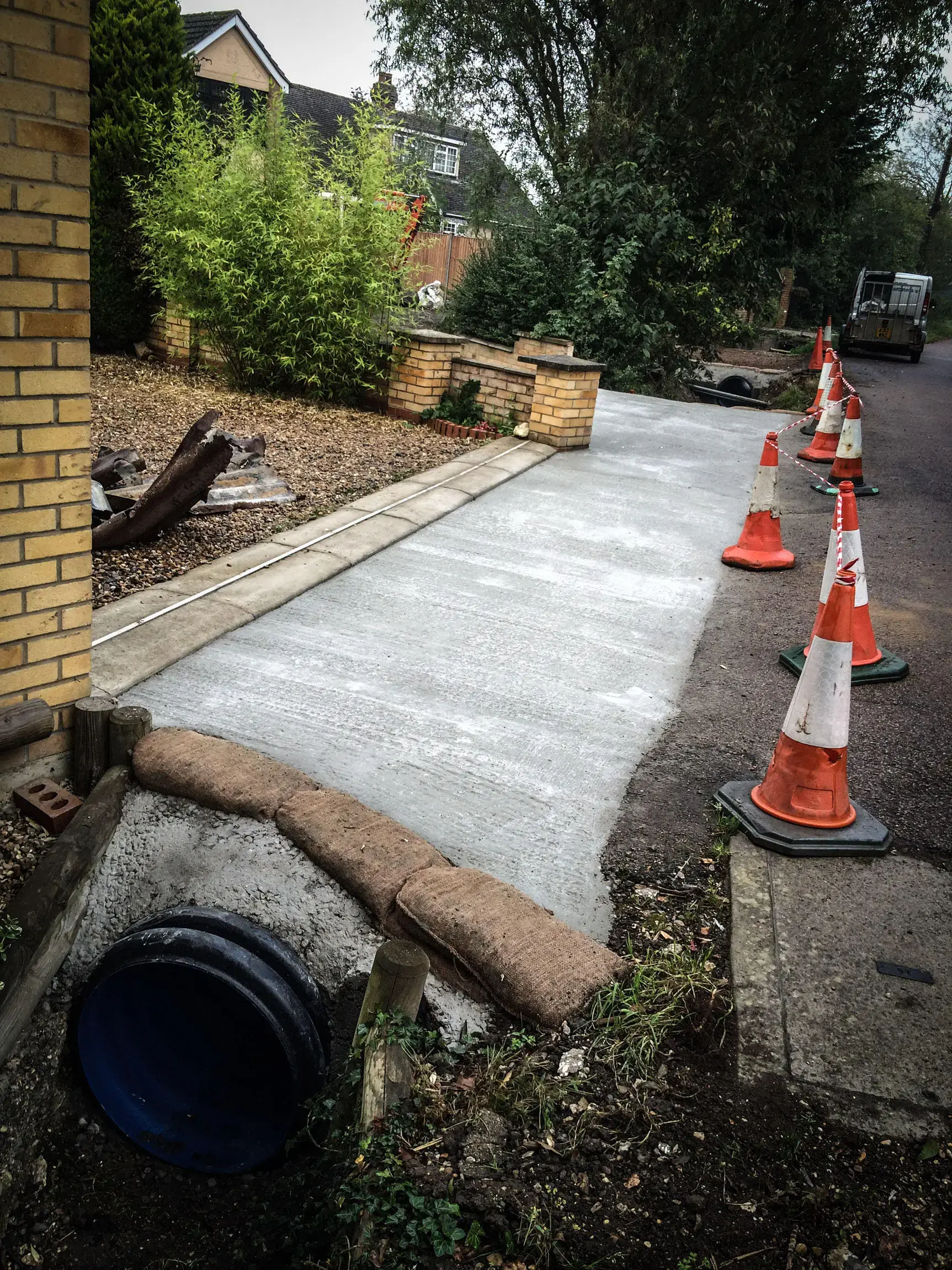 New concrete driveway with road cones