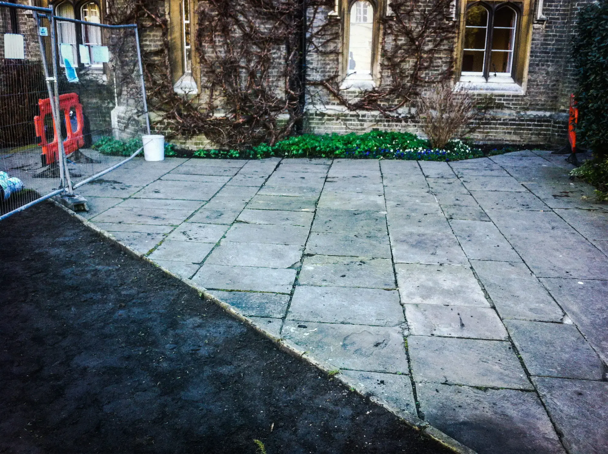 Paved courtyard by a historic building