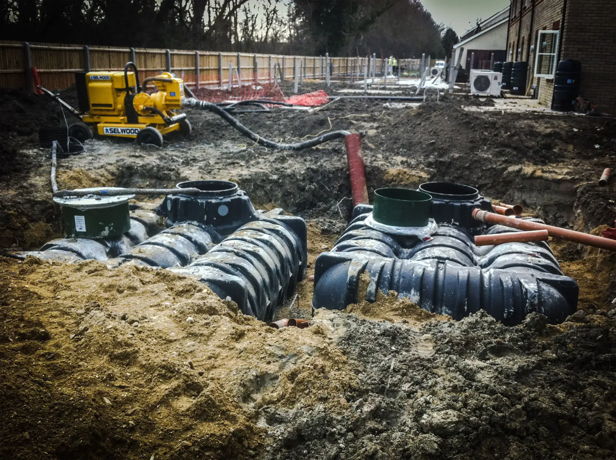 Attenuation tanks in an excavation